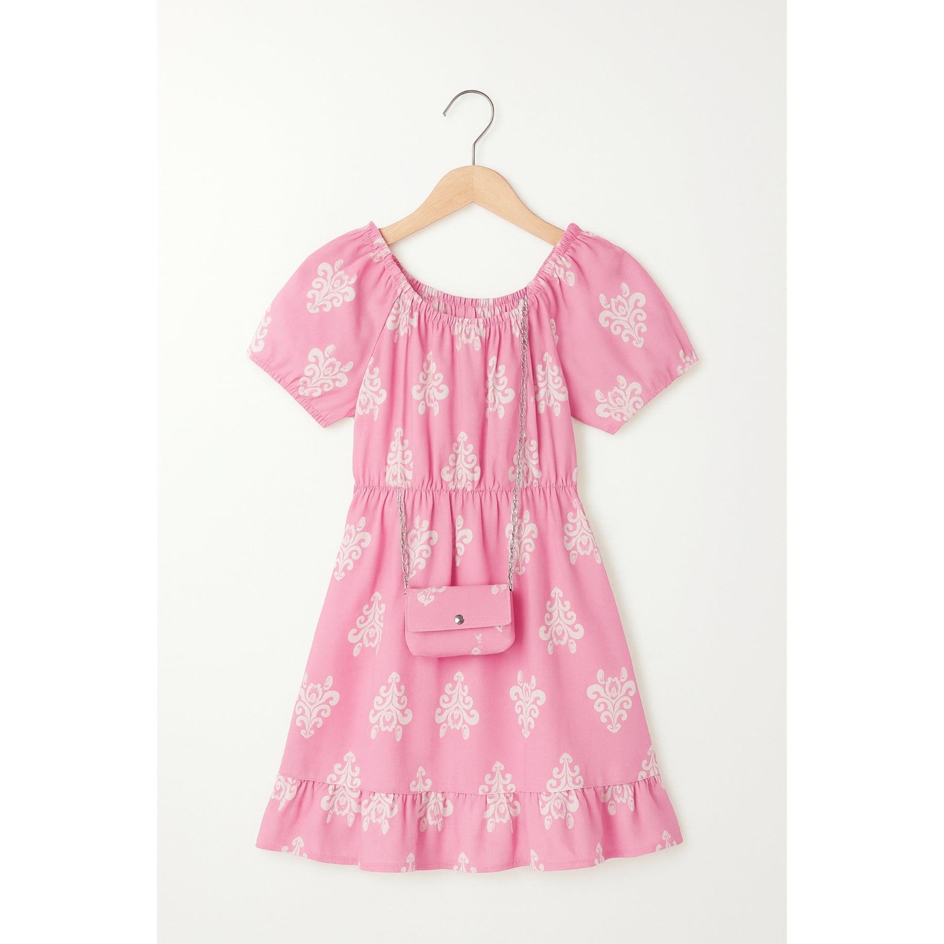 Meisjesjurk roze met witte print – pofmouwen en ruches