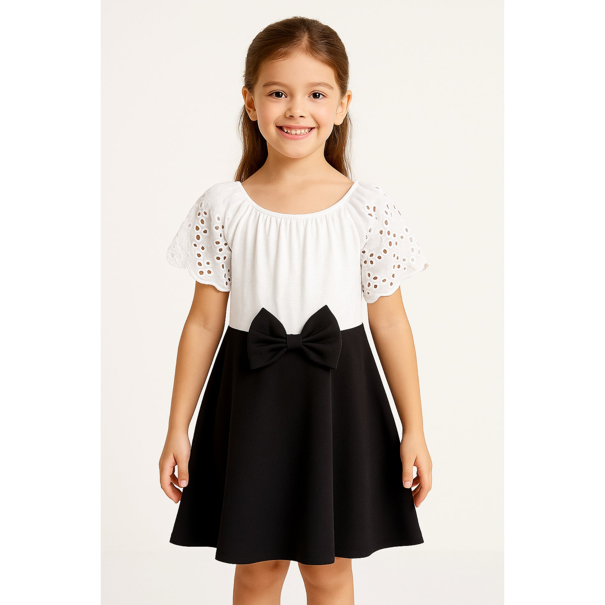 Meisjes jurk met strik – wit top en zwarte rok met strikdetail